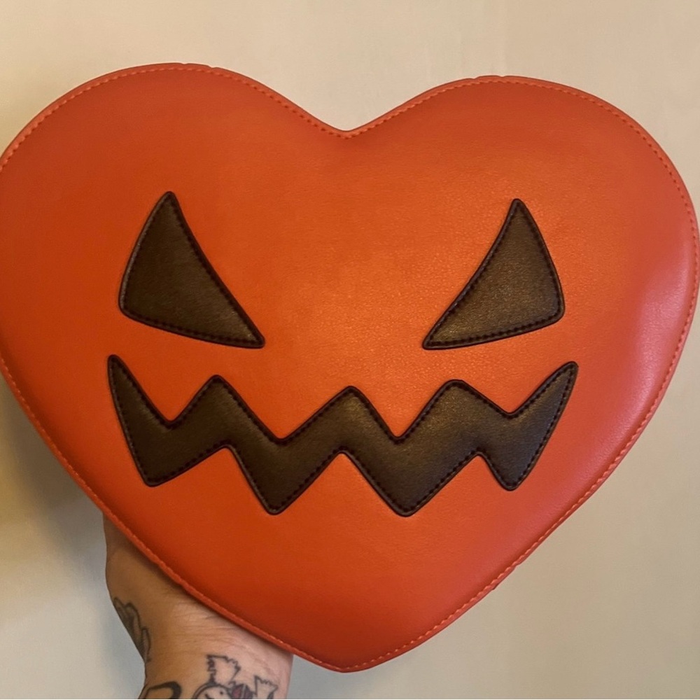 Orange Heart-Shaped crossbody/backpack Bag with Black Jack-O'-Lantern Design